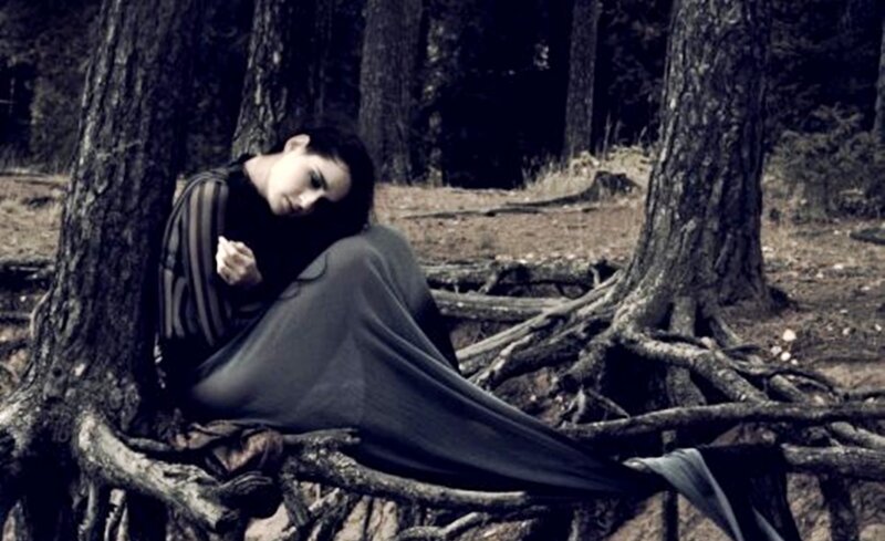 Woman Sitting in Forest — Gray