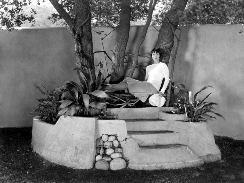 Woman Sitting in Garden — Black