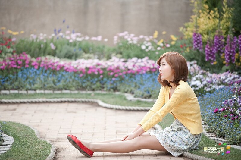 Woman Sitting in Garden — Yellow