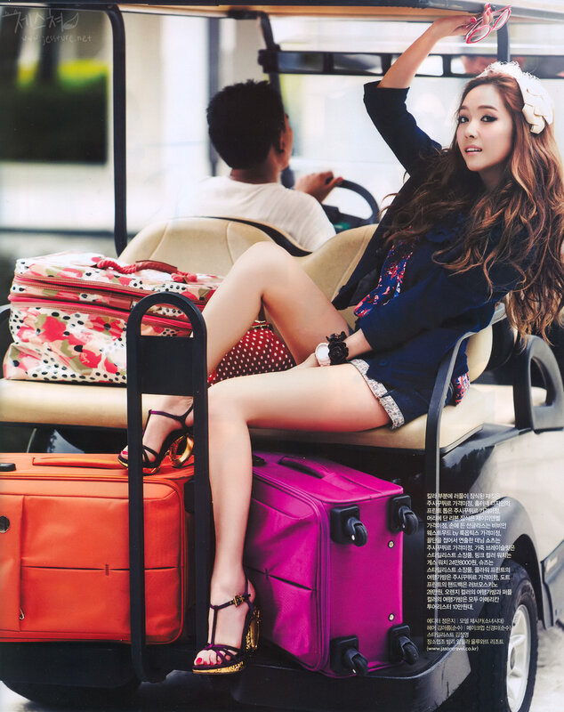 woman sitting in golf cart with luggage