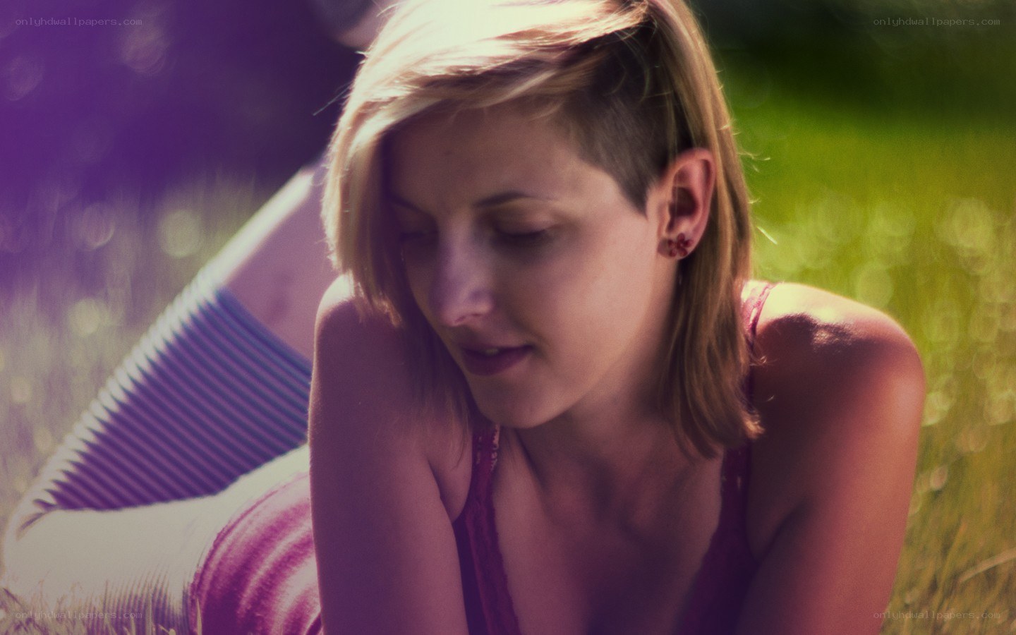 woman sitting in grass