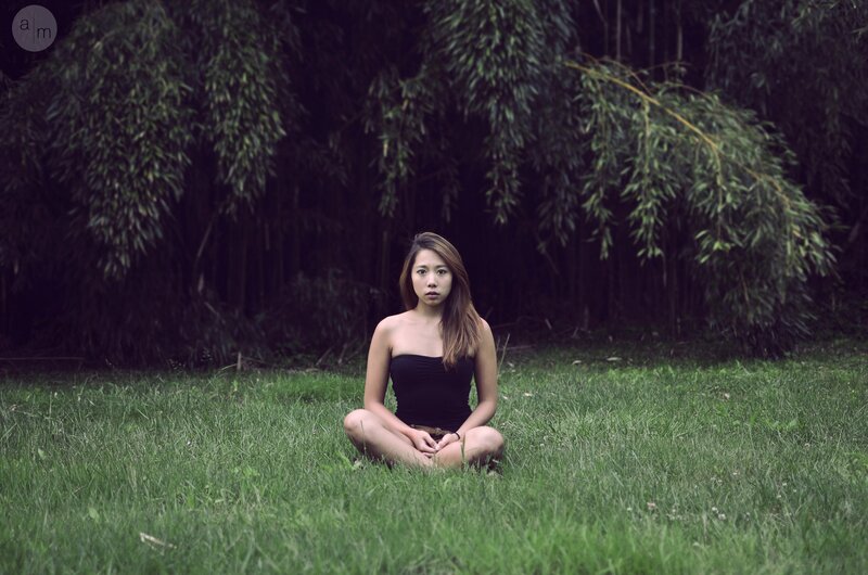 woman sitting in grass