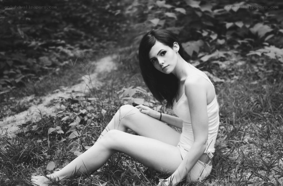woman sitting in grass