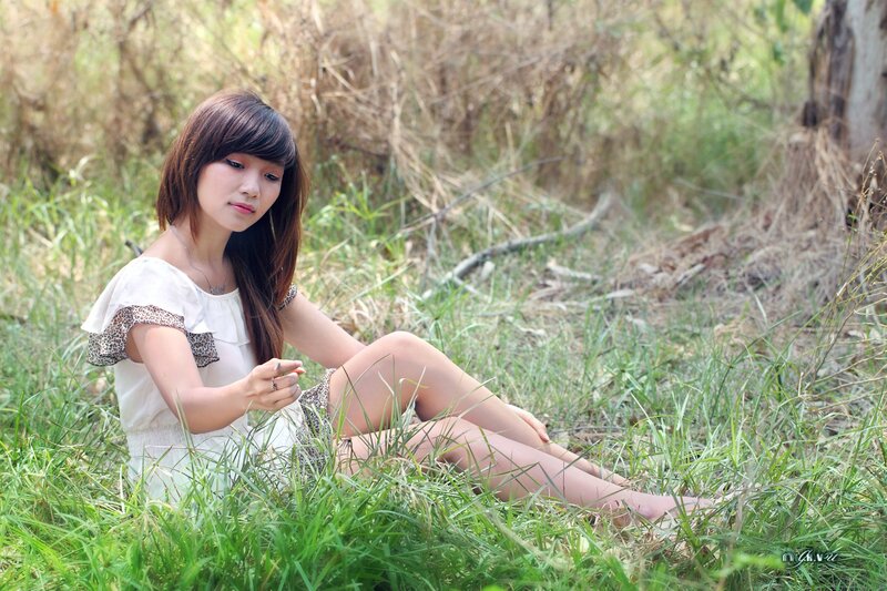 woman sitting in grass