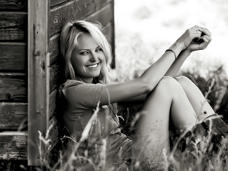 Woman Sitting in Grass — Black, Relaxed