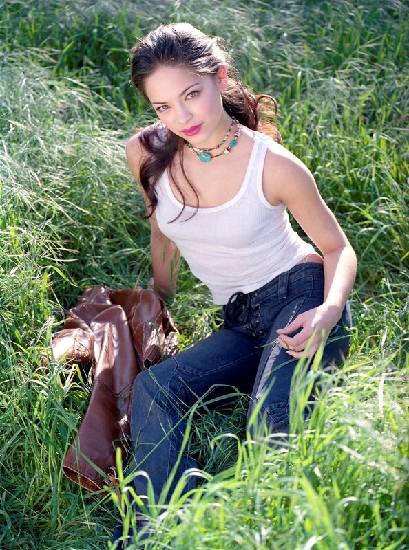 woman sitting in grass field