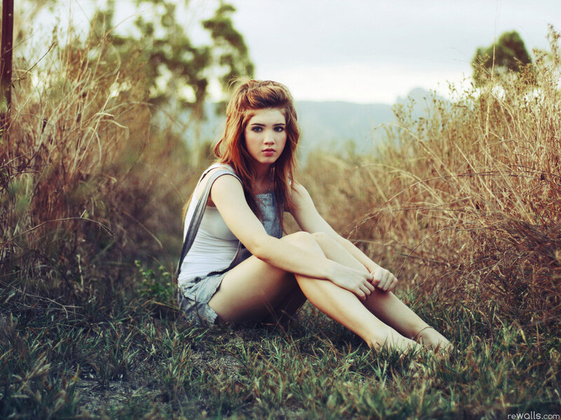Woman Sitting in Grass — Green, Contemplative