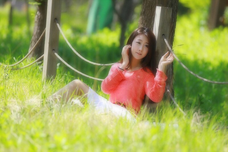 Woman Sitting in Grass — Green, Serene, Afternoon, Photograph, Tree
