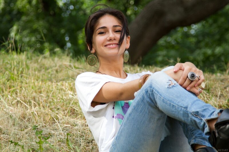 woman sitting in grass smiling