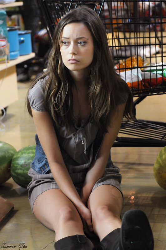 woman sitting in grocery store