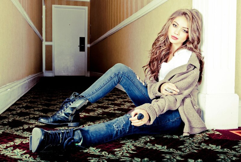 woman sitting in hallway