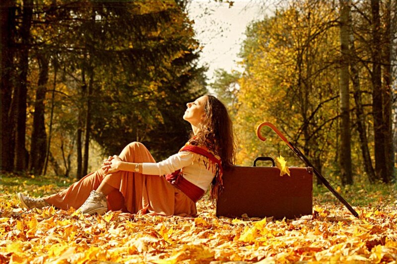 Woman Sitting in Leaves
