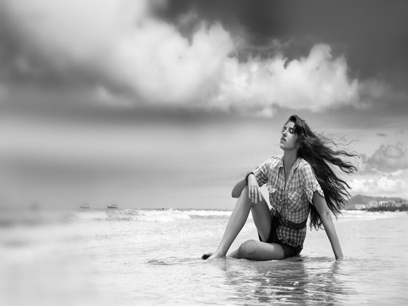 Woman Sitting in Ocean — Black