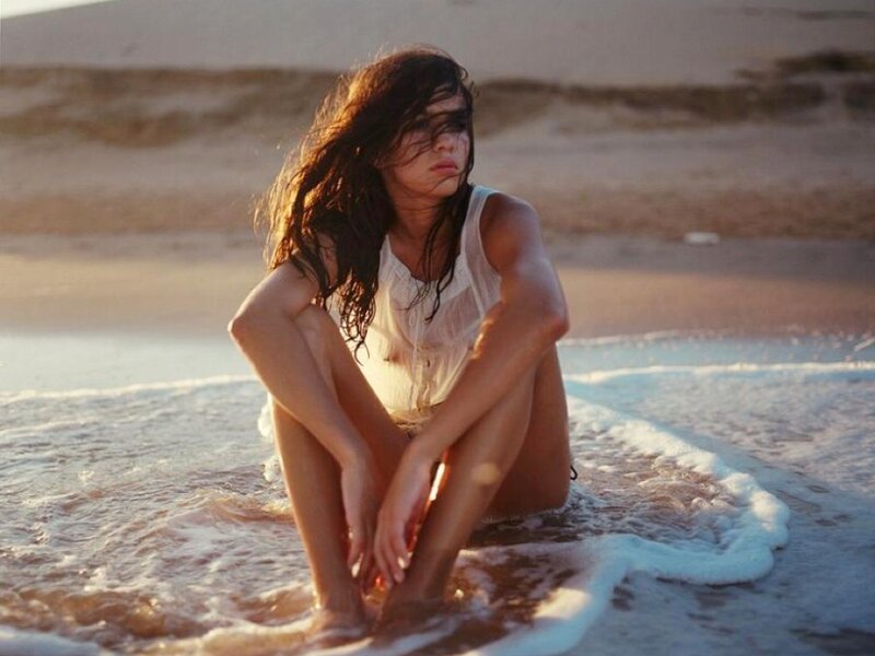 Woman Sitting in Ocean