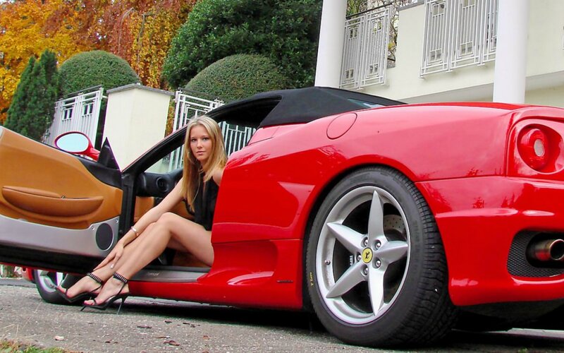 Woman Sitting in Red Car