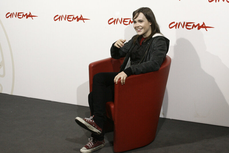 woman sitting in red chair