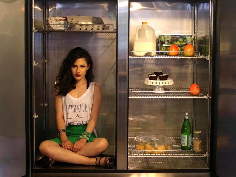 Woman Sitting in Refrigerator