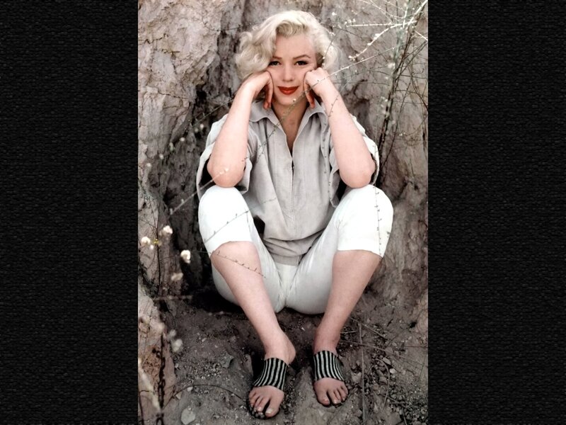 Woman Sitting in Rock