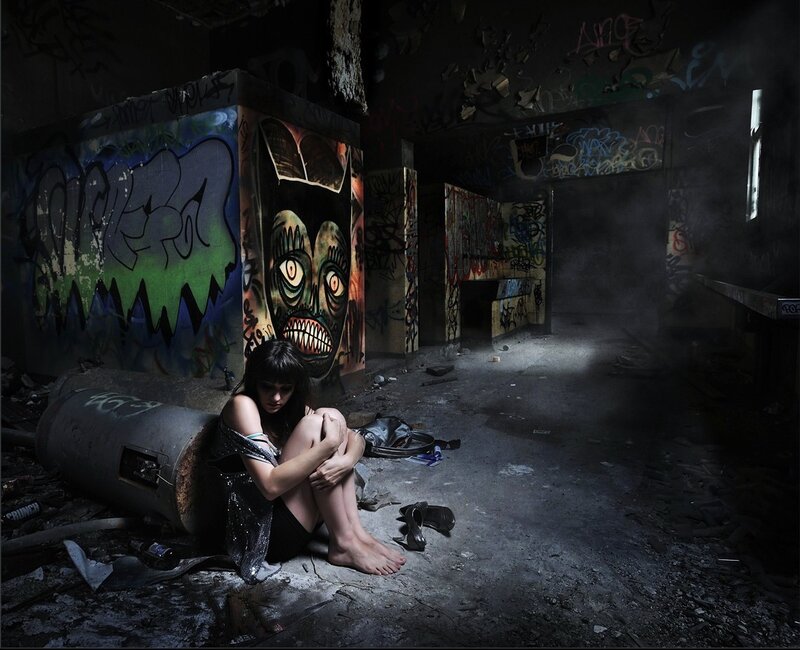 Woman Sitting in Ruin