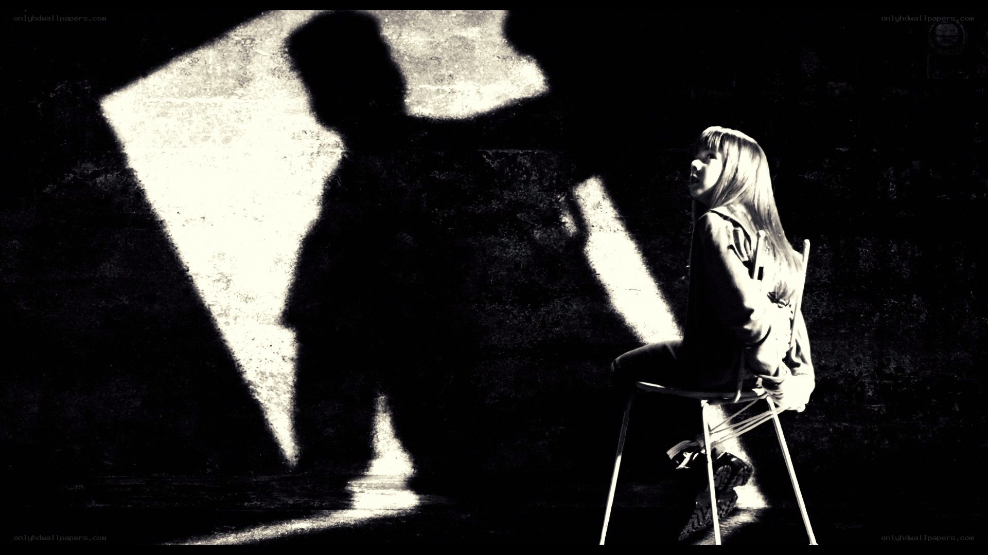 woman sitting in shadow