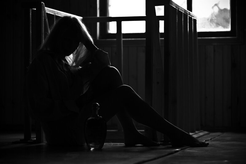 woman sitting in silhouette