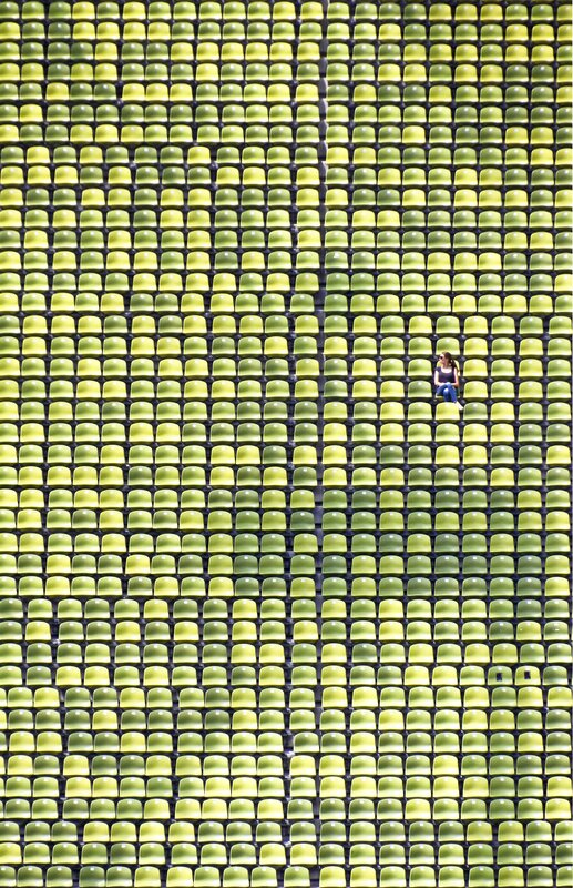 Woman Sitting in Stadium