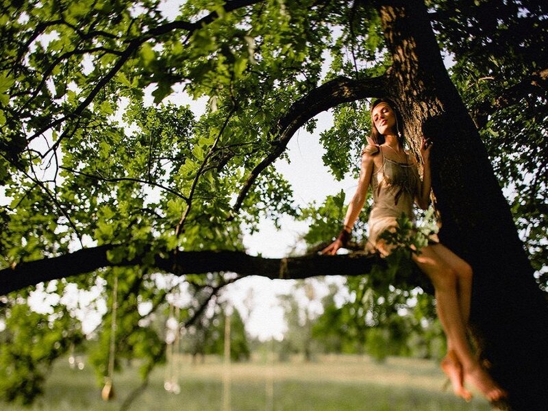 Woman Sitting in Tree — Green