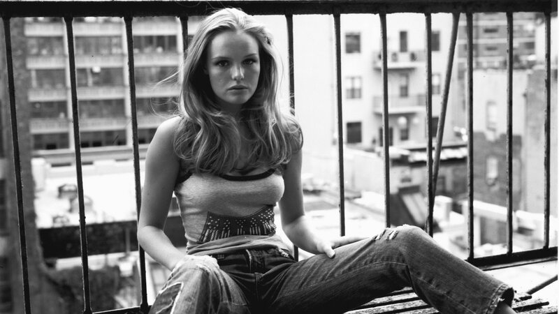 woman sitting on a balcony