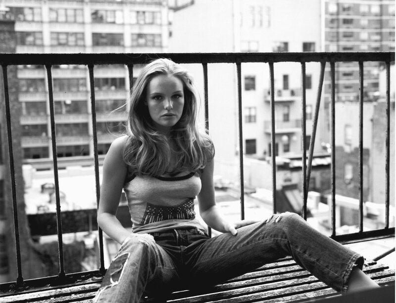 woman sitting on a balcony