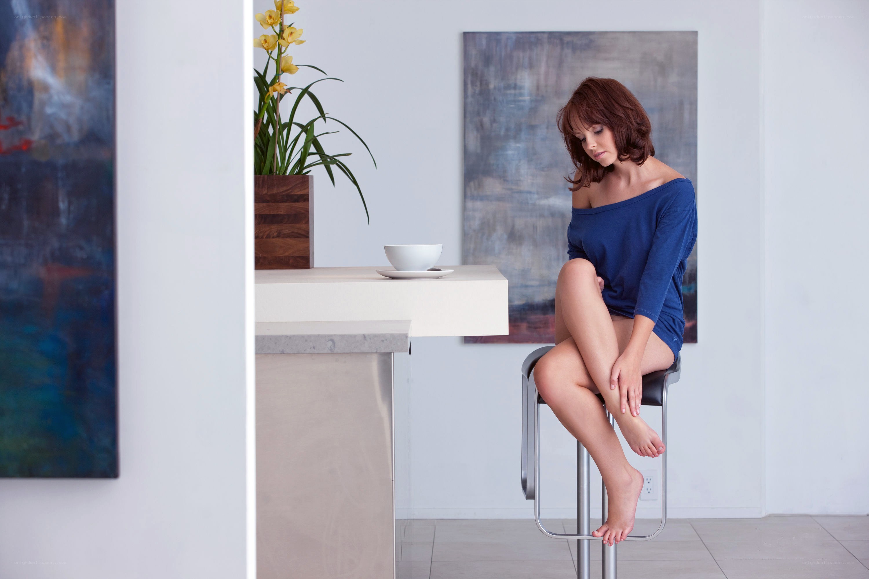 Woman sitting on a bar stool