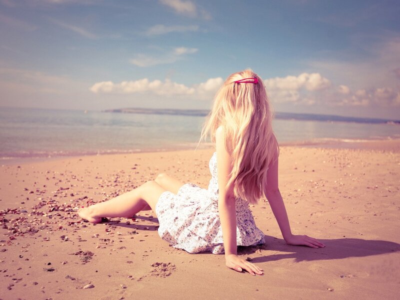 Woman sitting on a beach