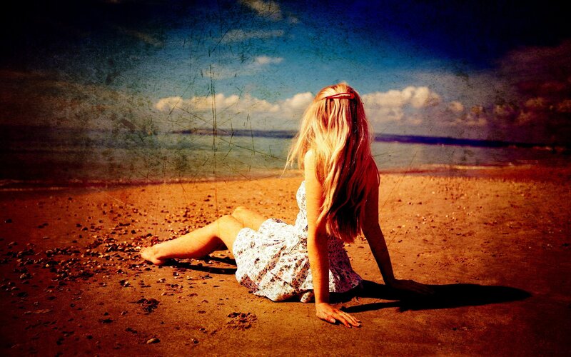 Woman sitting on a beach