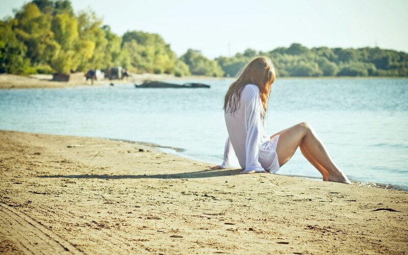 Woman sitting on a beach