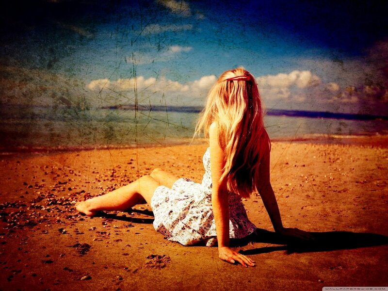 Woman sitting on a beach