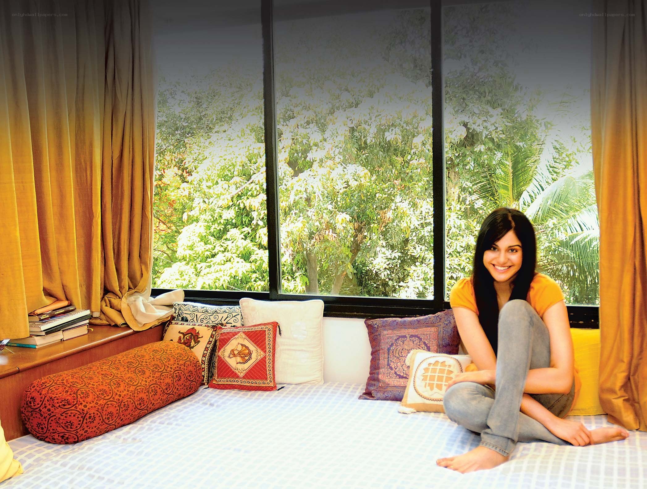 woman sitting on a bed
