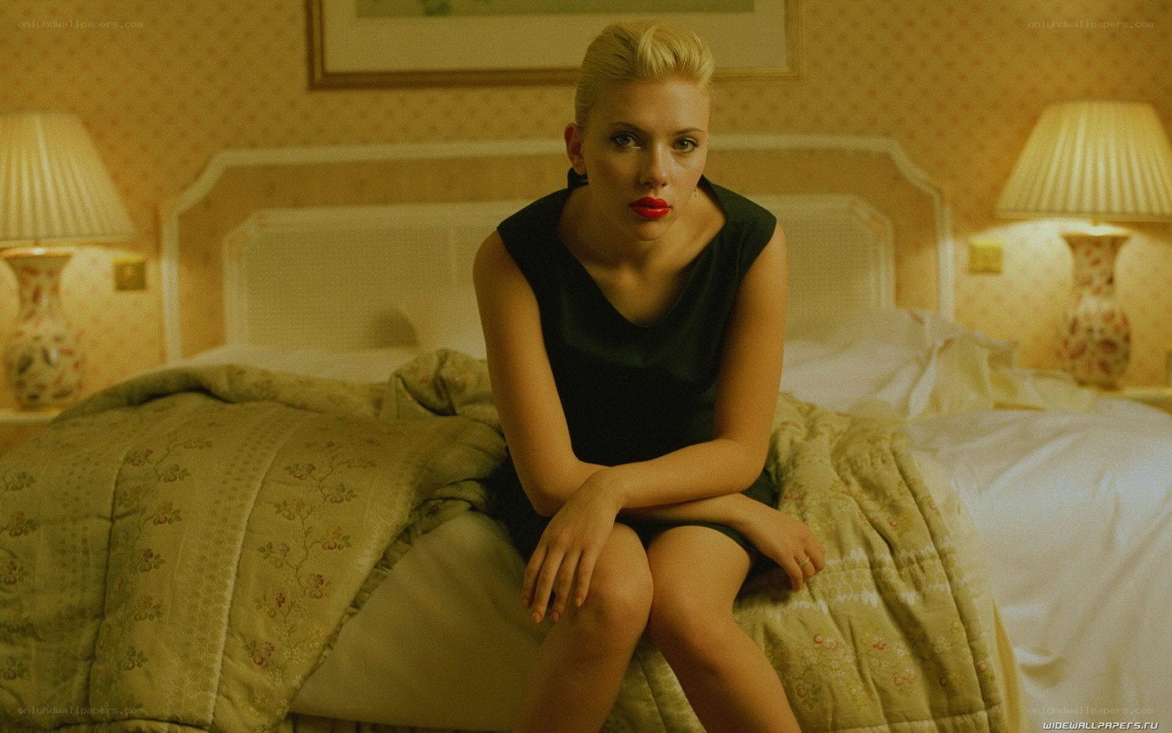 woman sitting on a bed