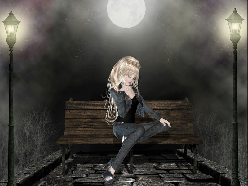 woman sitting on a bench at night