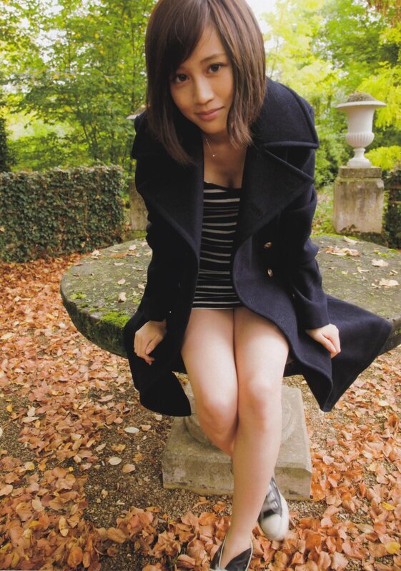 woman sitting on a bench in autumn