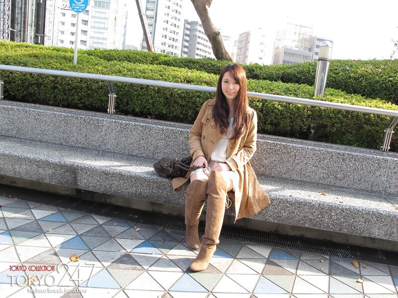 Woman sitting on a bench in Tokyo