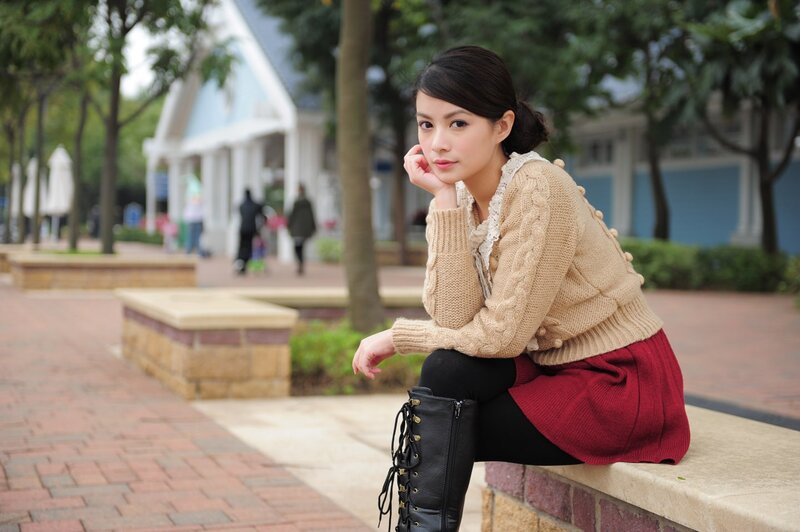 Woman sitting on a bench outdoors