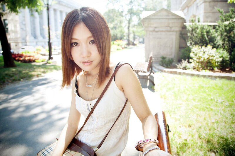 woman sitting on a bench outdoors
