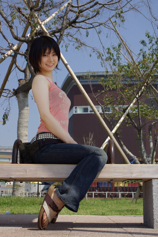 Woman sitting on a bench outdoors