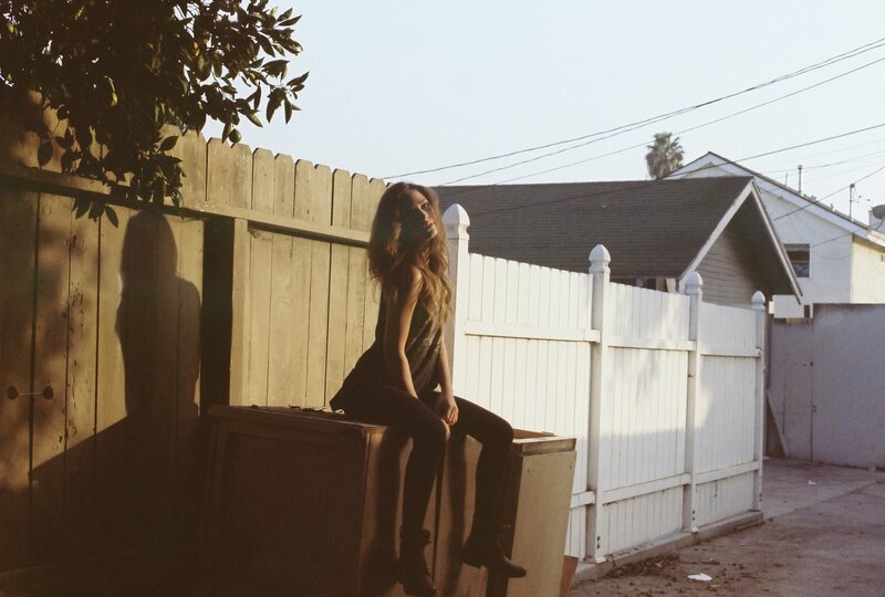 woman sitting on a box