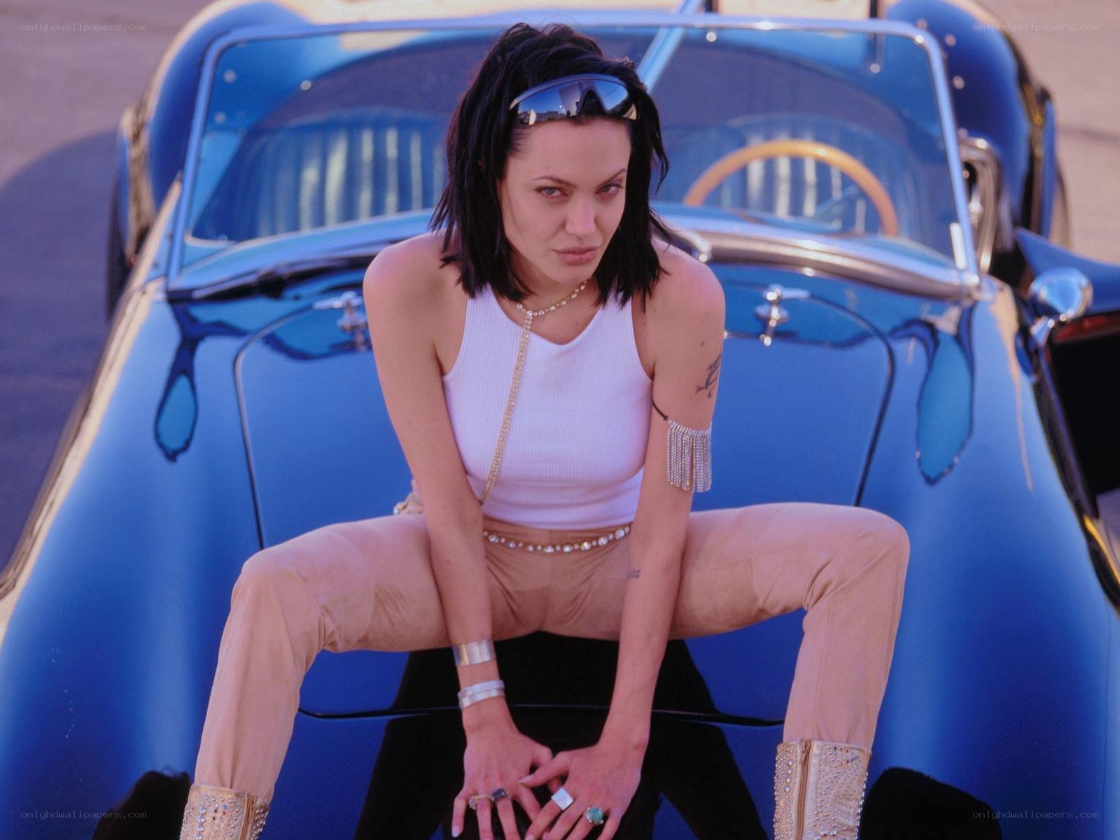 woman sitting on a car