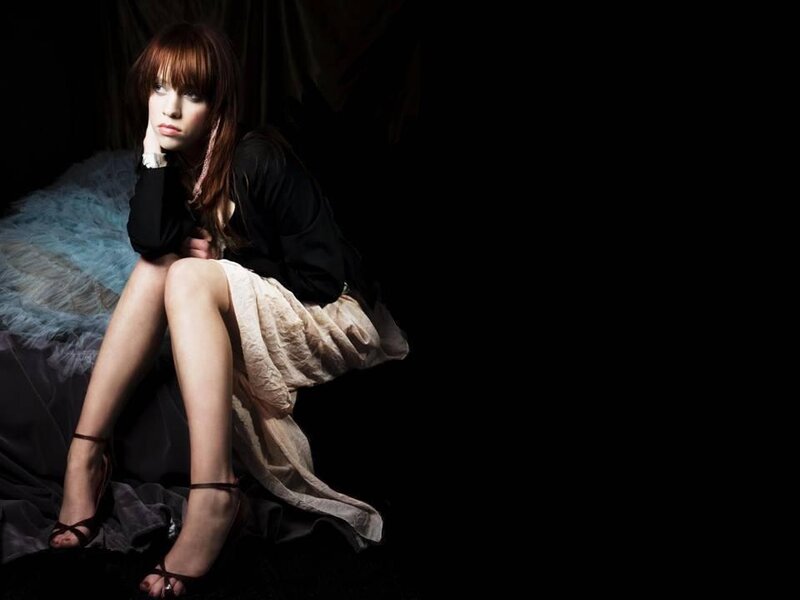 Woman Sitting on a Chair — Black