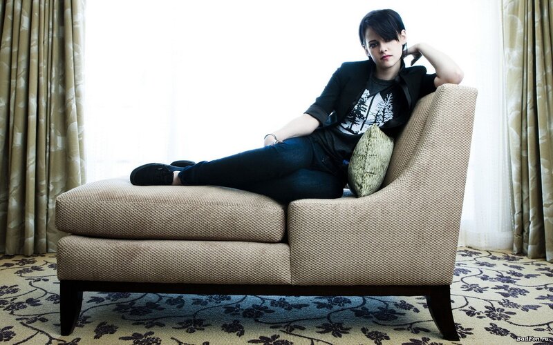 woman sitting on a chaise lounge