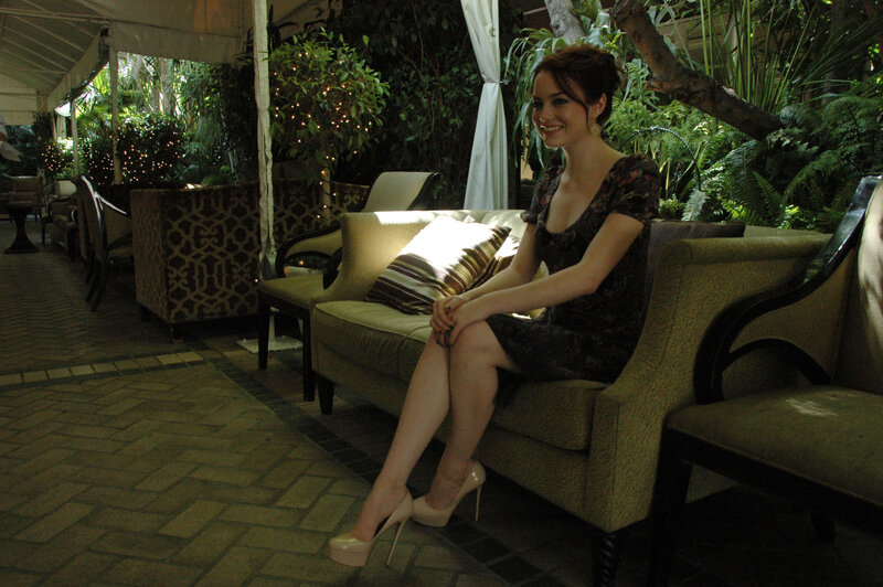 woman sitting on a couch outdoors