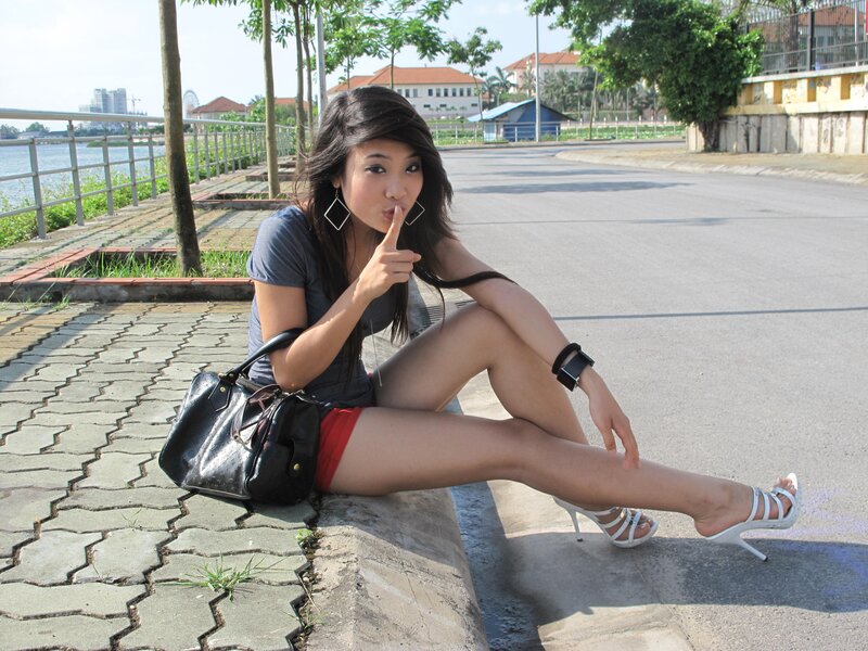 woman sitting on a curb