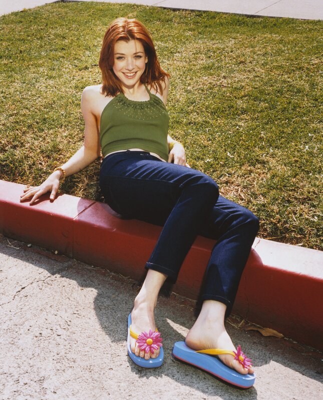 Woman sitting on a curb