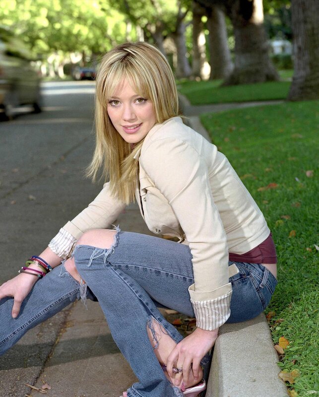 woman sitting on a curb